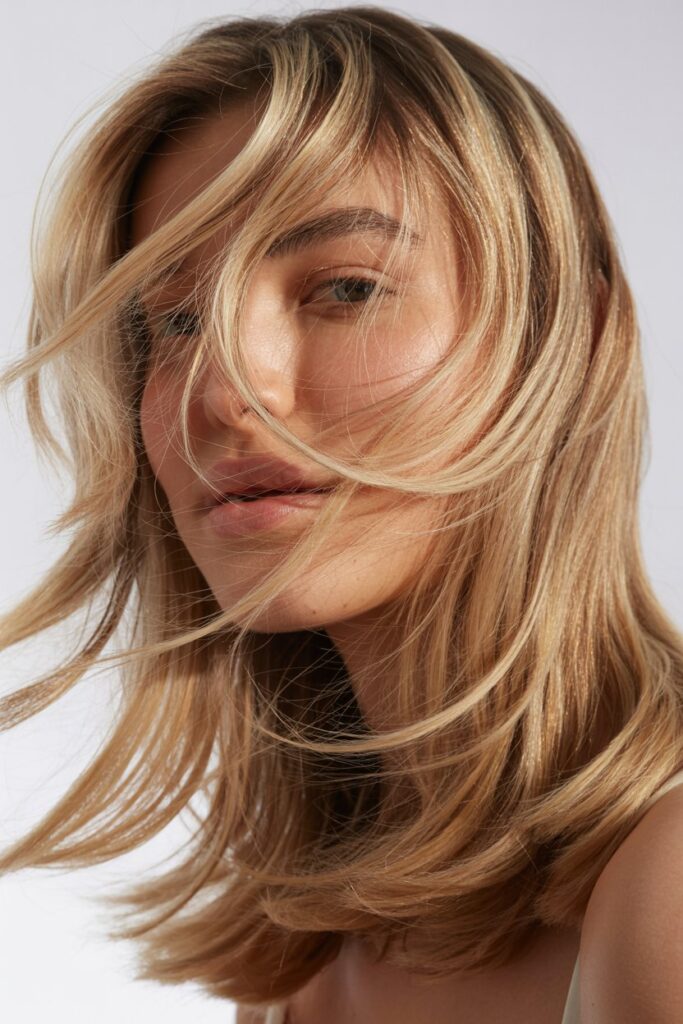 7. Wispy Layers with Face Highlights